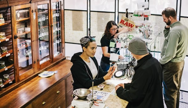 Beej Jackson, left, and Amber Bacca serve customers in Evergreen Apothecary in Denver. In 2012, 55% of Colorado voters said yes to legalizing recreational marijuana. Photo: CNN.com